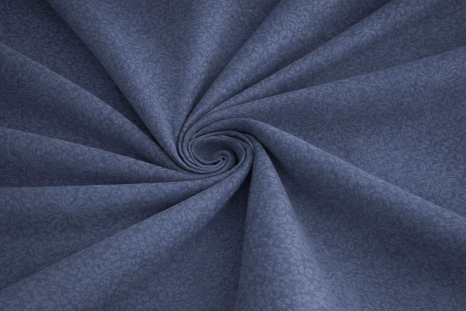 Close-up of indigo blue embossed fabric texture – pure cotton fitted bed sheet with premium floral embossed pattern for king size double bed by Homio