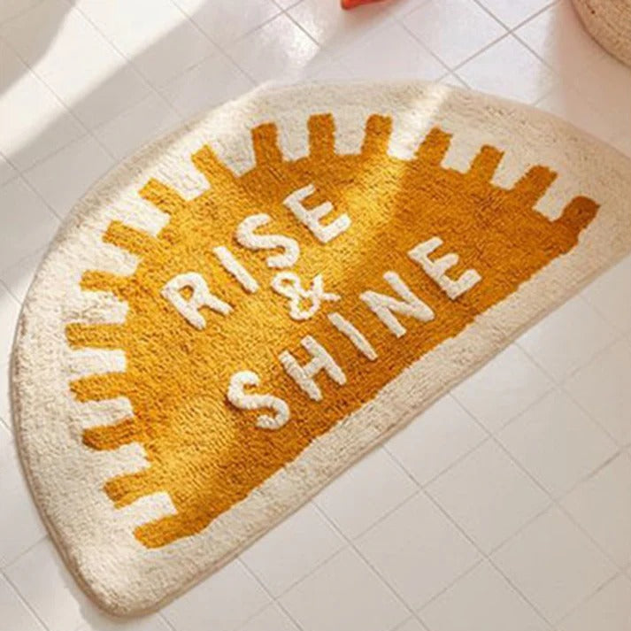 Sunrise anti-slip microfibre door mat with “Rise & Shine” text placed on bathroom floor