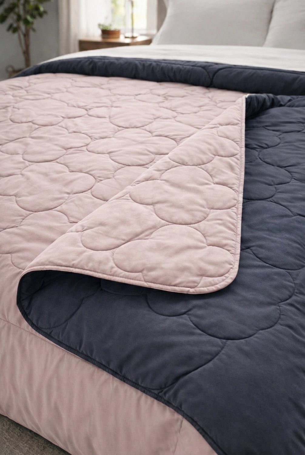 Folded edge view showing soft quilted microfiber comforter layers and stitching detail