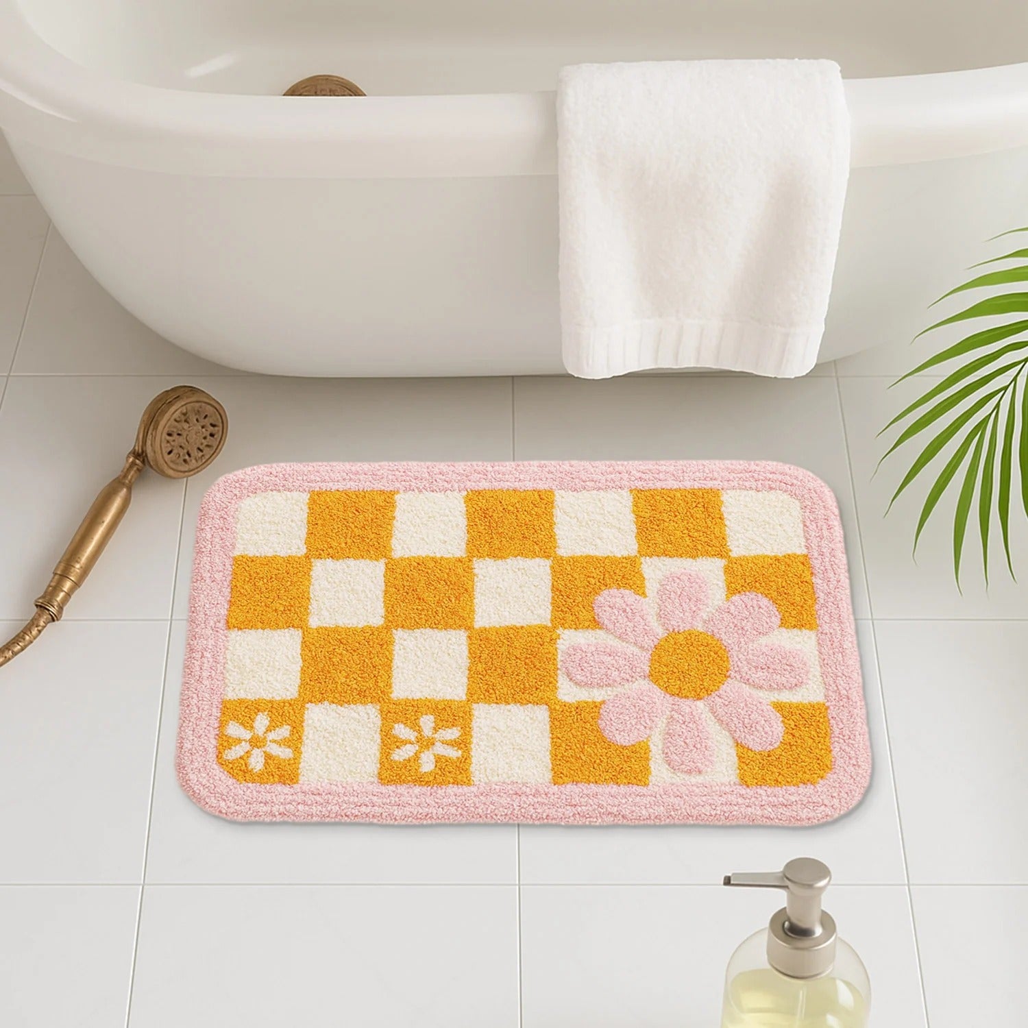 Epsori Orange microfiber door mat with checker pattern and flower design placed beside bathroom sink