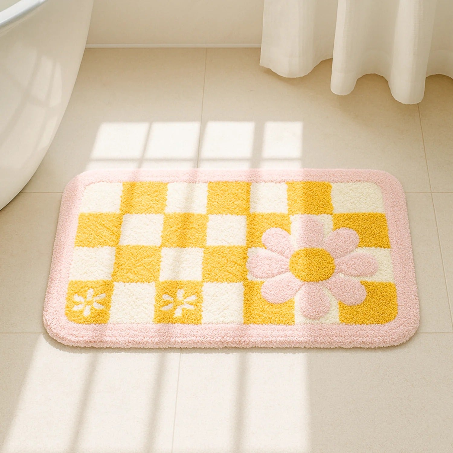 Epsori Yellow microfiber door mat with checker pattern and flower design placed on bathroom floor