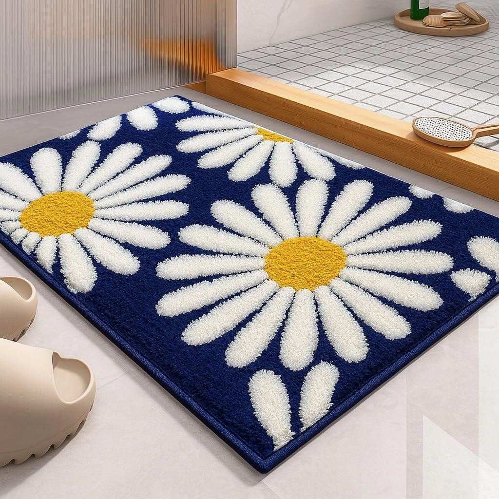 blue door mat with large white daisy pattern placed at home entrance with soft microfiber surface
