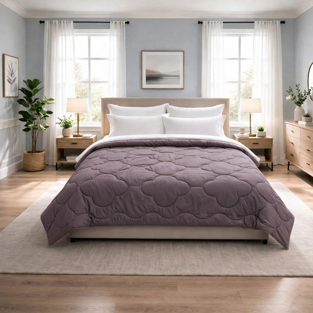 Petal and Parchment clover quilt reversible comforter laid across double bed in softly lit bedroom