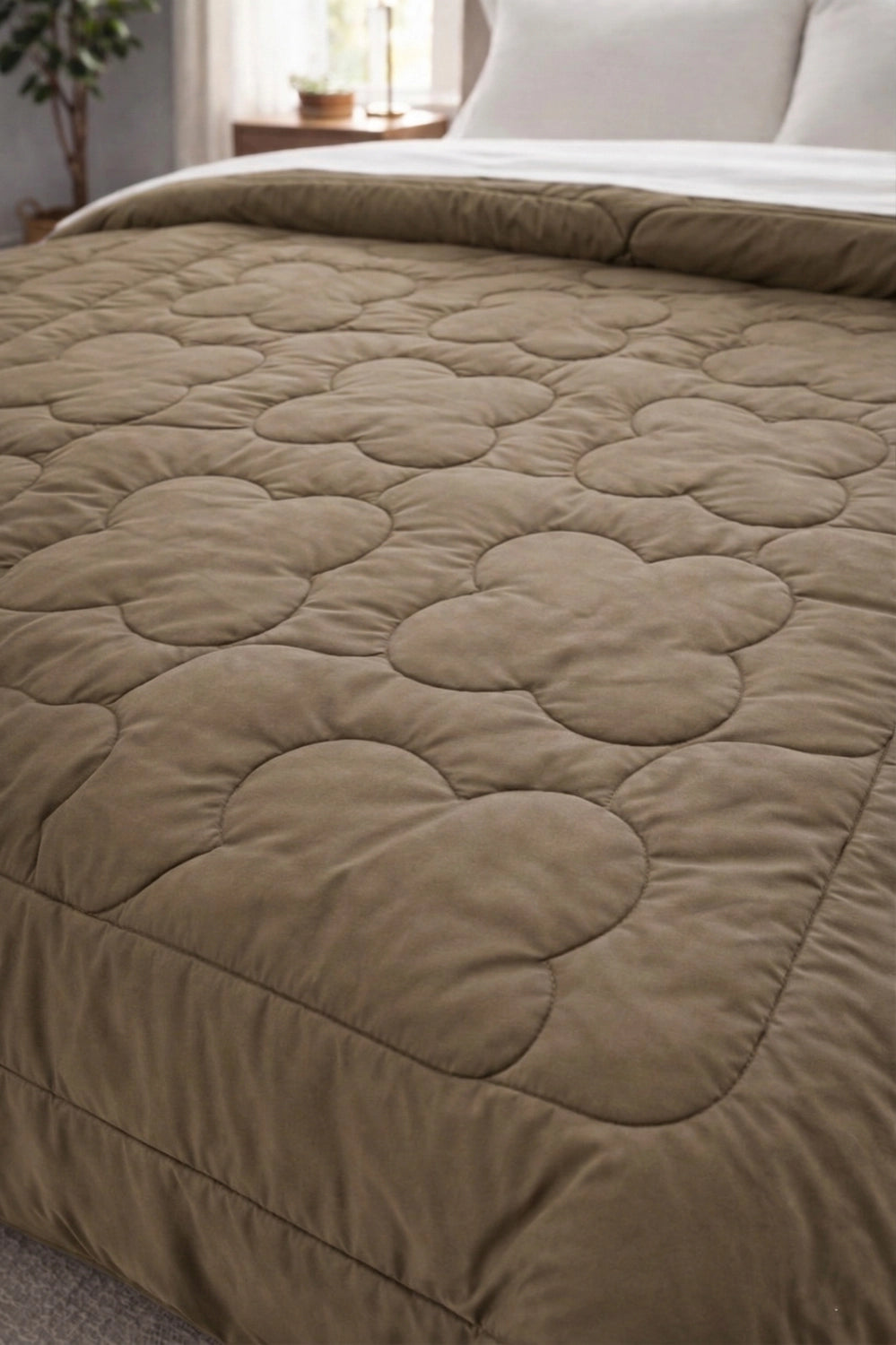 Detailed view of clover quilt stitching pattern on Sandstone and Silk comforter surface